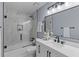 Modern bathroom with marble-tiled shower and patterned vanity offers stylish updates at 641 Virginia Ave, Suwanee, GA 30024