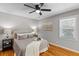 Cozy bedroom with natural light, hardwood flooring, and neutral color palette at 641 Virginia Ave, Suwanee, GA 30024