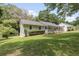 Quaint home features a well-manicured lawn, lush greenery, and a charming exterior at 641 Virginia Ave, Suwanee, GA 30024