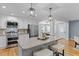 Beautiful kitchen features stainless appliances, granite counters, pendant lighting, and an open floorplan at 641 Virginia Ave, Suwanee, GA 30024