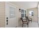 Cozy front porch with seating, offering a relaxing outdoor space with views of the surrounding landscape at 641 Virginia Ave, Suwanee, GA 30024