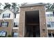 Brick building exterior with balconies and a central staircase at 8101 Par Four Way, Lithonia, GA 30038