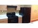 Kitchen with black appliances and light wood cabinets at 8101 Par Four Way, Lithonia, GA 30038