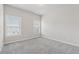 Light-filled bedroom with neutral carpet, two windows, and ample space at 4196 Morrison Way # 11, Atlanta, GA 30341