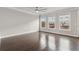 Bedroom featuring hardwood floors, ceiling fan and ample natural light from large windows at 4196 Morrison Way # 11, Atlanta, GA 30341