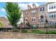 Brick front townhouse with black iron railings and landscaping at 4196 Morrison Way # 11, Atlanta, GA 30341
