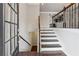 Inviting foyer features hardwood floors and a staircase leading to the upper level and basement at 4196 Morrison Way # 11, Atlanta, GA 30341