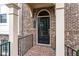 Townhouse entrance with black door and brick accents at 4196 Morrison Way # 11, Atlanta, GA 30341