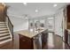 Kitchen with center island, granite countertops, stainless steel appliances, open to living room and stairs at 4196 Morrison Way # 11, Atlanta, GA 30341