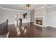Spacious living room boasts a stone fireplace, hardwood floors, and an open layout at 4196 Morrison Way # 11, Atlanta, GA 30341