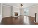 Bright living room features hardwood floors, stone fireplace, and access to the outdoor space at 4196 Morrison Way # 11, Atlanta, GA 30341