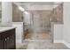 Bathroom featuring a glass-enclosed shower with gray tile, bench seating and multiple showerheads at 4196 Morrison Way # 11, Atlanta, GA 30341