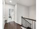 Upstairs landing with hardwood floors and access to the bedrooms and bathrooms at 4196 Morrison Way # 11, Atlanta, GA 30341