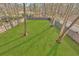 Expansive fenced backyard featuring lush lawn and mature trees, perfect for outdoor activities at 812 Stratford Rd, Avondale Estates, GA 30002