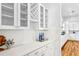Elegant bar area features custom cabinets, decorative wine storage, and sleek countertops; perfect for entertaining at 812 Stratford Rd, Avondale Estates, GA 30002