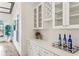 Stylish bar area with white cabinetry, wine storage, and a sleek countertop, perfect for entertaining guests at 812 Stratford Rd, Avondale Estates, GA 30002