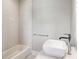 Modern bathroom featuring subway tile, a vessel sink, and a chrome faucet, creating a sleek and contemporary design at 812 Stratford Rd, Avondale Estates, GA 30002