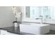 Stylish bathroom with a vessel sink, modern faucet, and a decorative mirror, offering a clean and contemporary look at 812 Stratford Rd, Avondale Estates, GA 30002