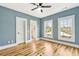 Bright bedroom with an ensuite bathroom, hardwood floors, and two windows, offering a comfortable and stylish design at 812 Stratford Rd, Avondale Estates, GA 30002