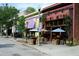 Street view featuring Brick Store Pub and its inviting outdoor barrel tables at 812 Stratford Rd, Avondale Estates, GA 30002