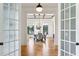 Elegant dining room with hardwood floors, coffered ceiling, and modern lighting, perfect for entertaining guests at 812 Stratford Rd, Avondale Estates, GA 30002