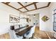 Elegant dining room featuring coffered ceiling, designer lighting, and hardwood floors, ideal for formal dinners at 812 Stratford Rd, Avondale Estates, GA 30002