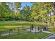 Fenced-in dog park with benches, water fountain and waste station for a convenient pet experience at 812 Stratford Rd, Avondale Estates, GA 30002