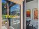 Storefront entrance with glass windows and 'Rising Son' signage, offering a glimpse of the inviting interior and colorful art at 812 Stratford Rd, Avondale Estates, GA 30002