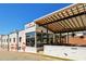 Inviting restaurant exterior with a charming patio, featuring colorful murals and a welcoming atmosphere at 812 Stratford Rd, Avondale Estates, GA 30002