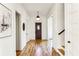 Inviting foyer with hardwood floors, crown molding, and a view of the staircase and front door at 812 Stratford Rd, Avondale Estates, GA 30002