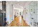 Bright foyer featuring hardwood floors, elegant lighting, and views into the adjacent living spaces at 812 Stratford Rd, Avondale Estates, GA 30002