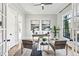 Stylish home office featuring neutral tones, a ceiling fan, and ample natural light from large windows at 812 Stratford Rd, Avondale Estates, GA 30002