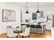 Bright kitchen with stainless appliances, white cabinets, granite counters and hardwood floors at 812 Stratford Rd, Avondale Estates, GA 30002