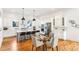 Spacious kitchen with stainless steel appliances, an island with barstool seating, and hardwood flooring at 812 Stratford Rd, Avondale Estates, GA 30002