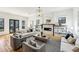 Spacious living room with hardwood floors, fireplace, and lots of natural light at 812 Stratford Rd, Avondale Estates, GA 30002