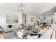Bright living room open to the kitchen with fireplace, hardwood floors, and lots of natural light at 812 Stratford Rd, Avondale Estates, GA 30002