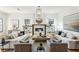 Elegant living room featuring neutral furniture, built-in bookshelves, and a cozy fireplace at 812 Stratford Rd, Avondale Estates, GA 30002