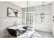 Elegant bathroom with subway tile, a standalone tub, a glass-enclosed shower, and modern fixtures at 812 Stratford Rd, Avondale Estates, GA 30002