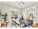 Stylish home office with hardwood floors, a ceiling fan, a large window, and plenty of natural light at 812 Stratford Rd, Avondale Estates, GA 30002