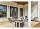 Covered patio with ceiling fan, furniture, and view of trees beyond the property at 812 Stratford Rd, Avondale Estates, GA 30002