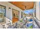 Relaxing porch features an outdoor seating area with modern wood ceilings and views of the surrounding landscape at 812 Stratford Rd, Avondale Estates, GA 30002