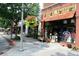 Street view with retail stores, including the Squash Blossom clothing boutique, in the neighborhood at 812 Stratford Rd, Avondale Estates, GA 30002