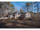 Cute house with burgundy shutters and a manicured lawn at 120 Emory Phillips Rd, Sharpsburg, GA 30277