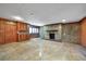 Spacious basement features a stone fireplace, wood cabinets, and neutral flooring at 3456 Paces Nw Pl, Atlanta, GA 30327