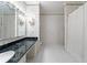 Bathroom with marble vanity, shower, and floral wallpaper at 3456 Paces Nw Pl, Atlanta, GA 30327