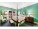 Spacious bedroom with a four-poster bed and French doors leading to a patio at 3456 Paces Nw Pl, Atlanta, GA 30327