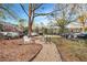 Common green space featuring mature trees, bench seating, walking paths and multi-Gathering residential at 3456 Paces Nw Pl, Atlanta, GA 30327