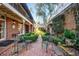 Charming brick courtyard with lush landscaping and seating at 3456 Paces Nw Pl, Atlanta, GA 30327