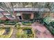 Secluded brick courtyard with manicured hedges, and patio furniture at 3456 Paces Nw Pl, Atlanta, GA 30327