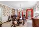 Formal dining room with chandelier, floral wallpaper, and elegant wood furniture at 3456 Paces Nw Pl, Atlanta, GA 30327